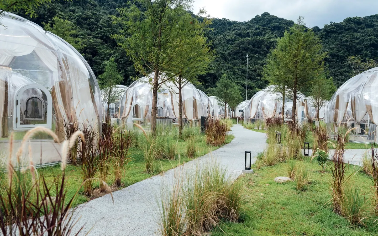 Domevora domes along a landscaped resort path