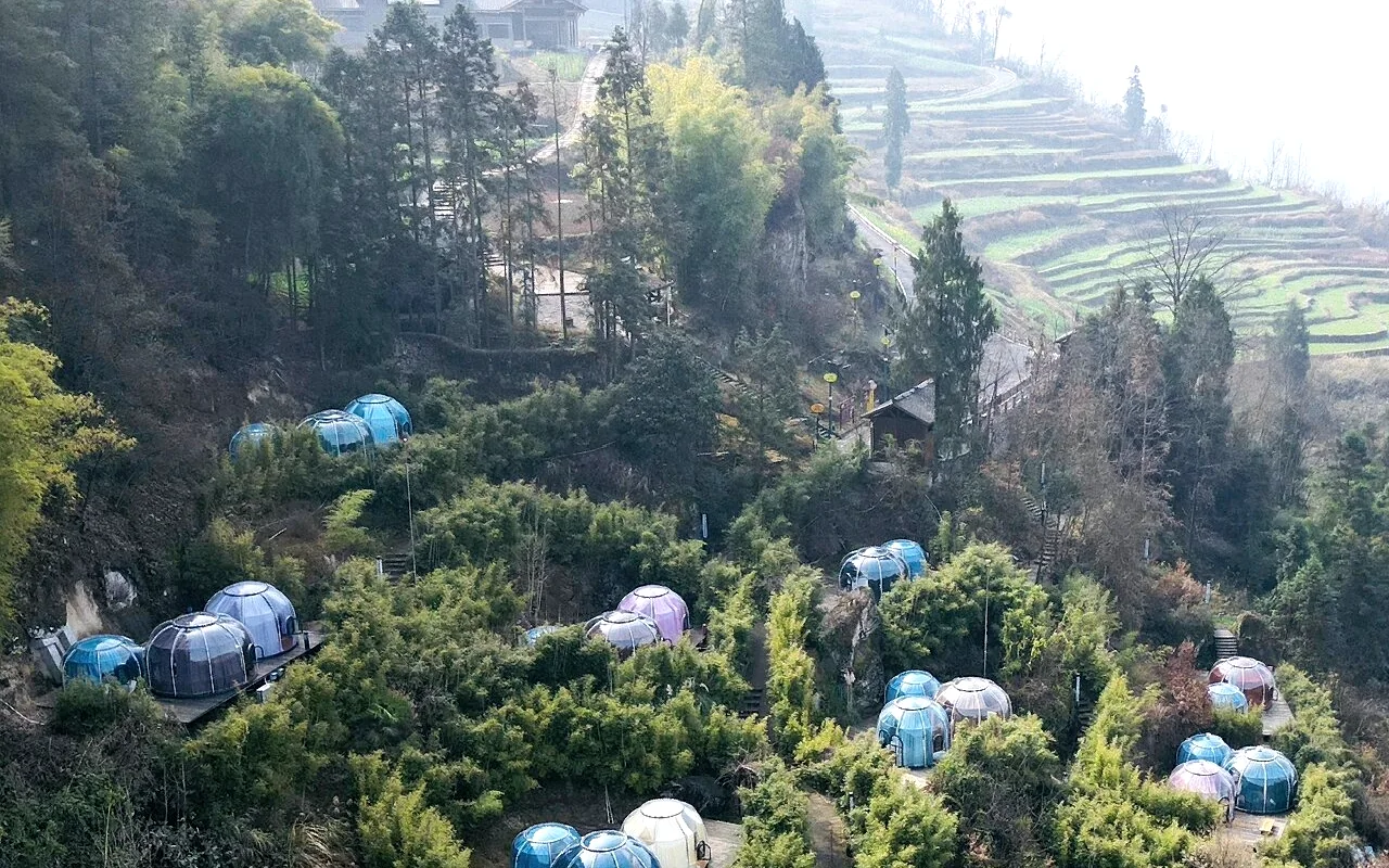 Aerial view of Domevora domes across a terraced hillside