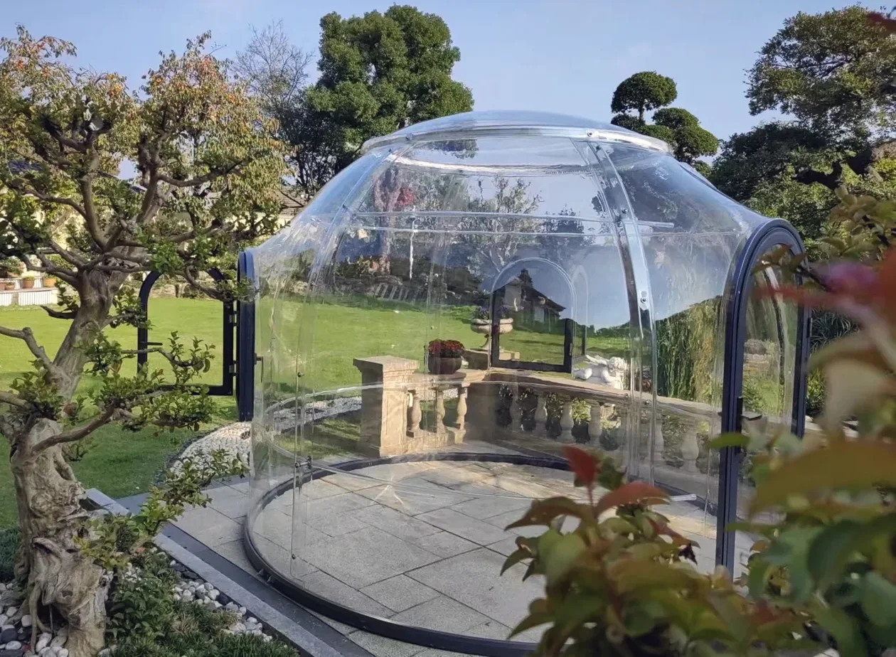 Round 3.0 m clear polycarbonate dome: a landscaped garden terrace with a stone balustrade